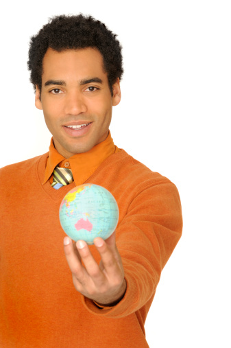 young modern businessman holding a small globeClick on an
