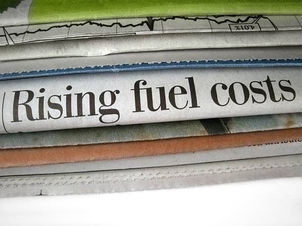 Rising Fuel Costs Newspaper headline Rising fuel cots fuel prices photos stock pictures, royalty-free photos & images