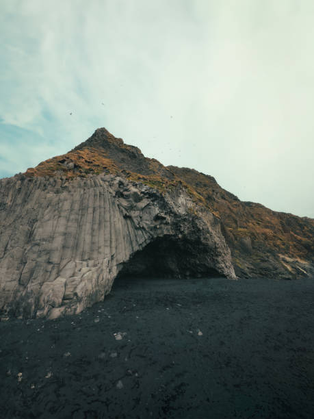 istock Front view of basalt rock wall in Reynisfjara beach, Iceland 1729145704