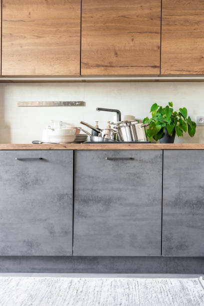 istock Dirty dishes and unwashed kitchen appliances filled the kitchen sink 1729145722