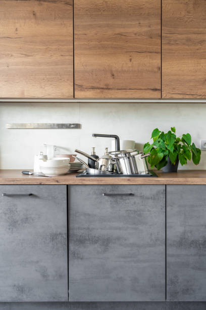 istock Dirty dishes and unwashed kitchen appliances filled the kitchen sink 1729146201