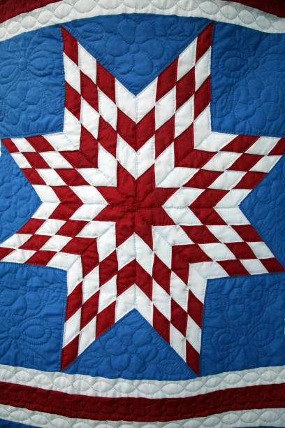 Amish Quilt Number 1. Vertical.Please see my other images of Amish Quilts in my SIMPLY AMISH LB. Please see my FULL FRAME and TEXTURE & BACKGROUND LB's also.These Amish women worked throughout the Winter months hand-sewing this collection of quilts.The quilts were hung by clothespins on a line. patriotic quilt stock pictures, royalty-free photos & images