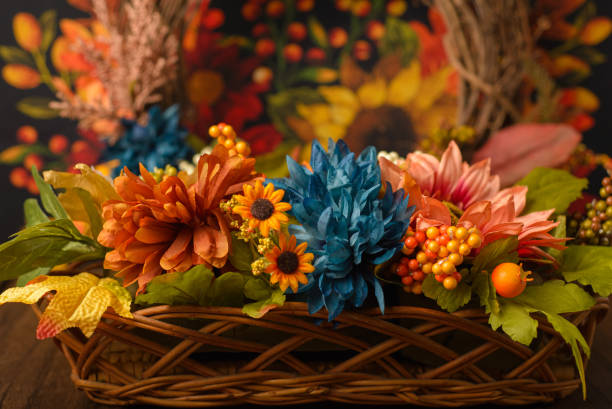 istock Wicker basket with autumn decorations on wooden table. 1729160762