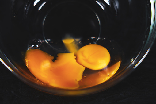 Egg yolk in a glass bowl, Horizontal image