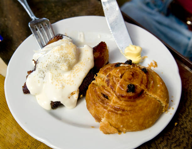 A typical wealthy Guatemalan Breakfast consisting of fried plantains covered by a rich cream with a pastry.See more of my Latin food Photos: