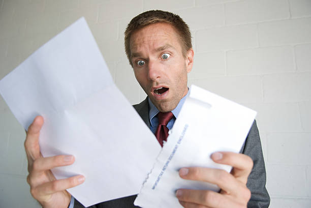 istock Businessman Opening Letter with Shocked Expression 172916433