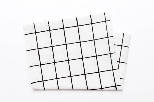 istock top view with white empty kitchen napkin isolated on table background. Folded cloth for mockup with copy space, Flat lay. Minimal style 1729164977