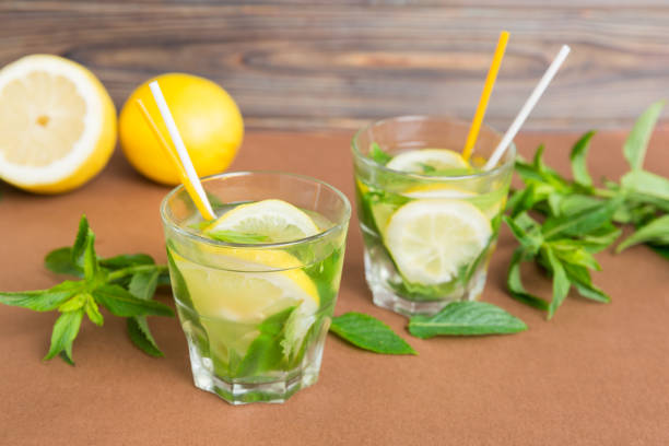 istock Mojito summer refreshing cocktail with ice and mint. mojito cocktail with lime, lemon and mint in a tall glass with a stick 1729164978