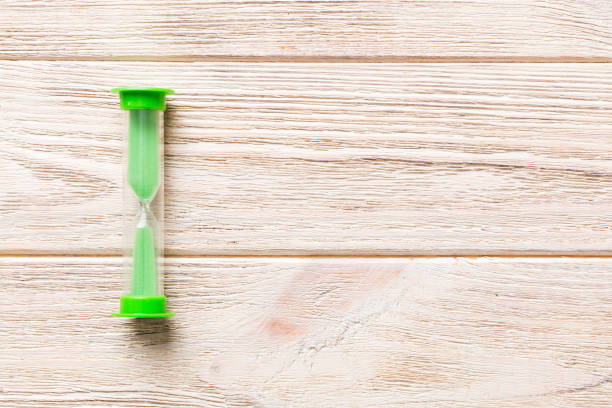 istock hourglass on the table, sand clock as time passing concept for business deadline, copy space 1729165374