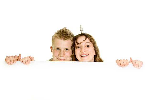 Couple holding sign or board isolated on white stock photo