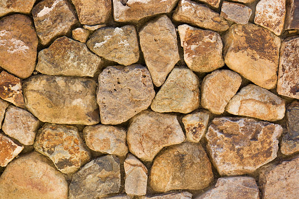 istock Stacked Natural Field Rock Wall Background 172916755