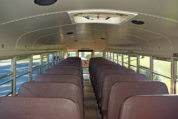 Interior of School Bus "An empty school bus, read for the start of the school year. Related Images." empty school bus stock pictures, royalty-free photos & images
