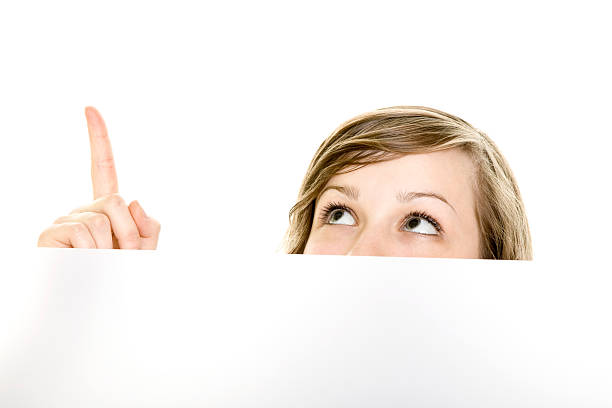 Girl pointing at something stock photo