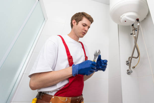 istock Professional plumber checking a boiler and pipes, boiler service concept. 1729178945