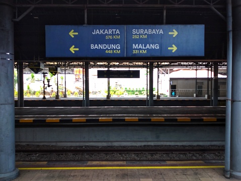 Surakarta, Indonesia - October 6, 2023 : City distance and direction signboard at Solo Balapan train station