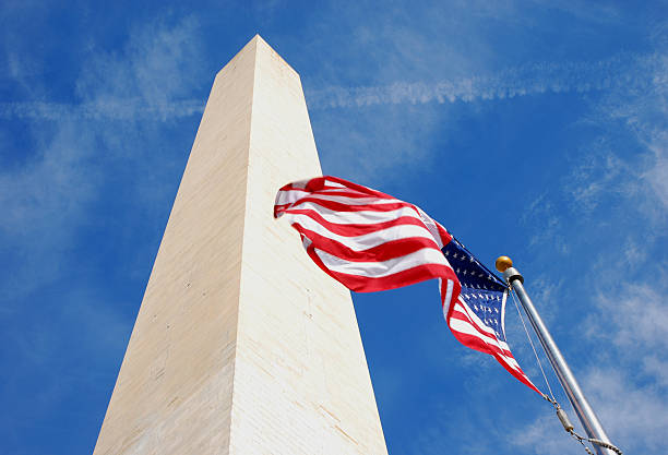 istock Washintong Monument and American Flag 172918532