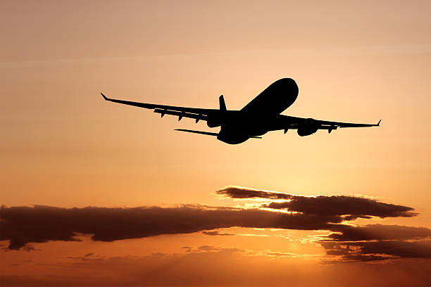 istock XL jet airplane taking off at dusk 172919095