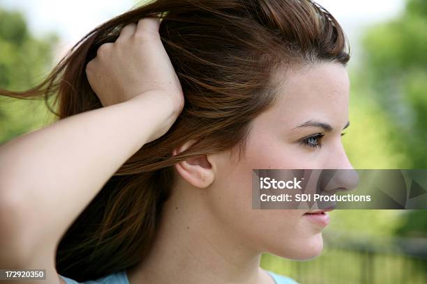 Looking Away Stock Photo - Download Image Now - Hand In Hair, Women, Adult