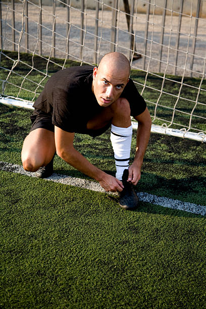 istock Soccer player tying his shoe 172920389