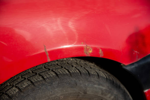 istock old peeling paint, cracks and rust on wheel arches 1729208692