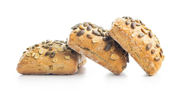 istock Whole grain bun with pumpkin seeds isolated on white background. 1729220389