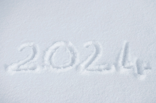 New year 2024 written on snow