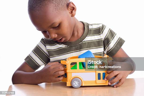 Young Boy Playing With School Bus Toy Stock Photo - Download Image Now - Child, Bus, Toy