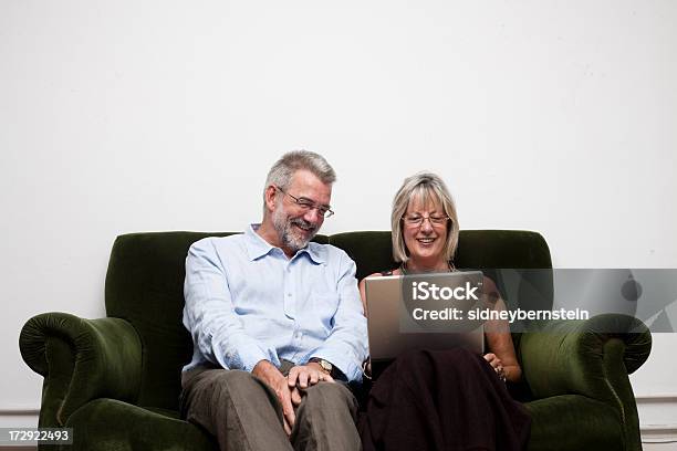 Parents With Laptop Stock Photo - Download Image Now - Active Seniors, Adults Only, Beautiful People