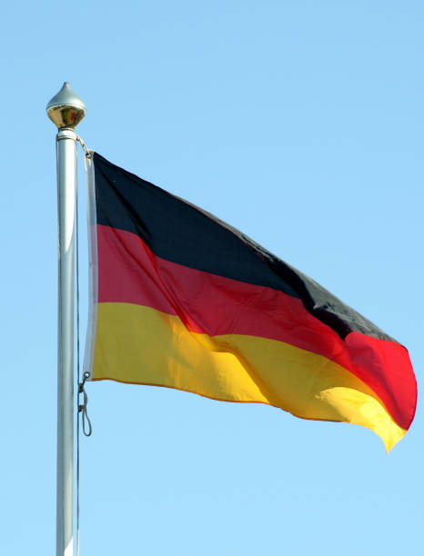 istock A German flag waving in the wind set on a clear blue sky 172922832