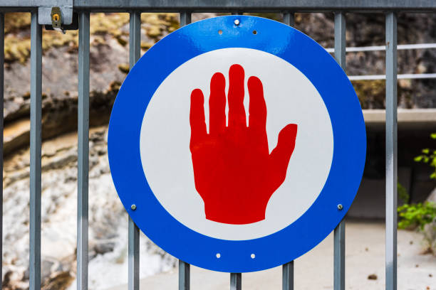 Hand stop sign at hydroelectric industry