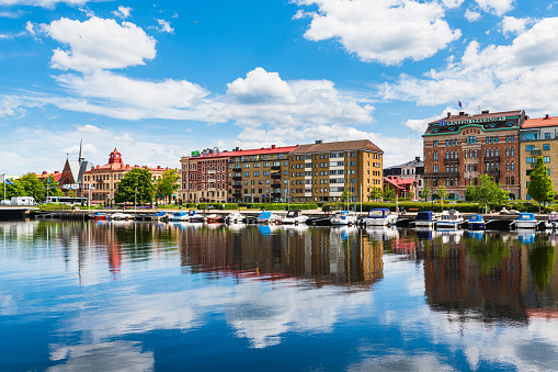 Buildings at Halmstad city in front of still river, Sweden