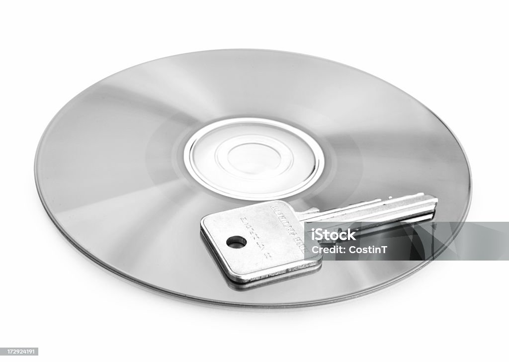 CD and key, computer security concept Metal key on CD or DVD surface Black And White Stock Photo