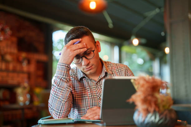 istock Tired businessman working trying to solve the problems 1729244967