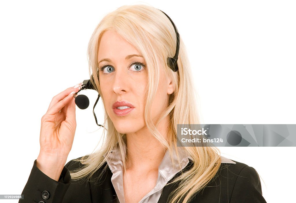 Donna in Tuta da lavoro con telefono con cuffia - Foto stock royalty-free di Adulto