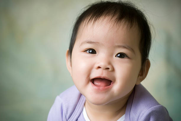 happy asian american baby stock photo