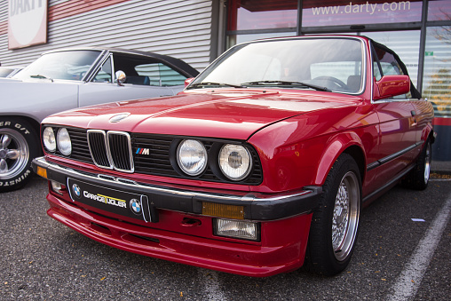 Mulhouse - France - 8 October 2023 - Front view of old red BMW M3 parked in the street