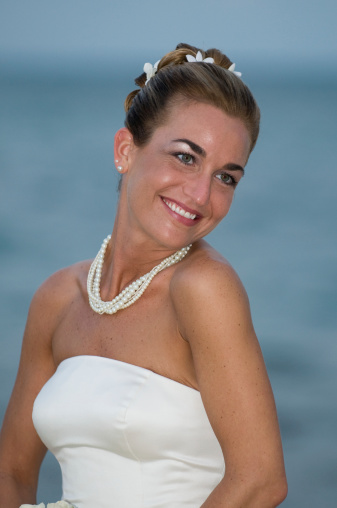 Portrait of young bride with ocean background