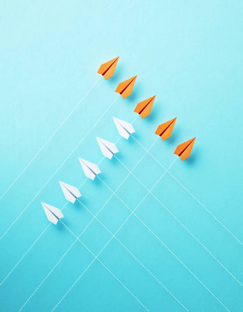 istock Paper Planes Flying On Different Directions On Blue Background 1729262955