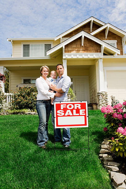 istock Young Family with Home for Sale 172926571