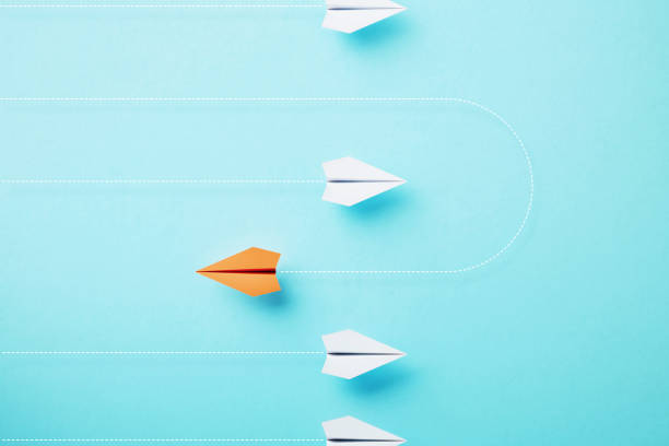 istock Paper Planes Flying On Different Directions On Blue Background 1729267326