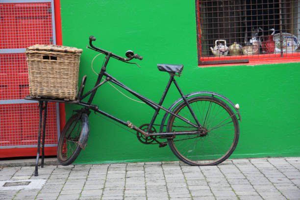 vintage bicycle against green wall