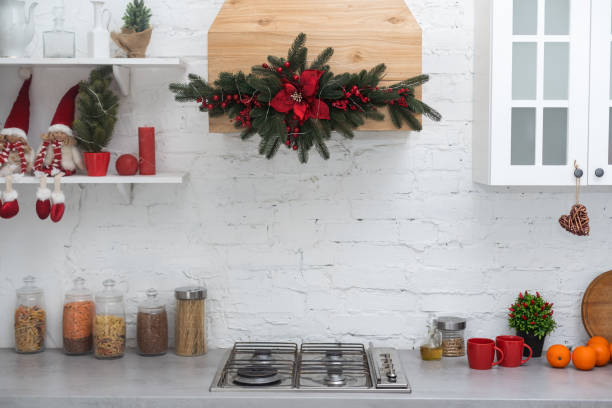 istock Interior light kitchen and red christmas decor. Preparing lunch at home on the kitchen concept 1729283126