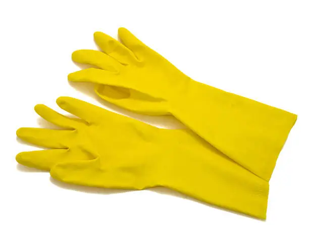 Yellow rubber gloves isolated on white