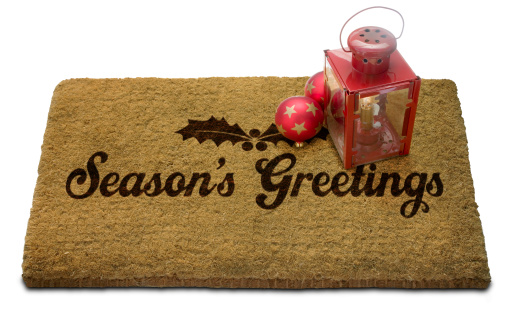 Seasonaas Greetings Doormat with Lantern and Christmas Bauble. Isolated on white. With Clip Path.