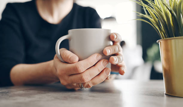 istock Girl Holding A Tea Cup In Her Hands 1729293291