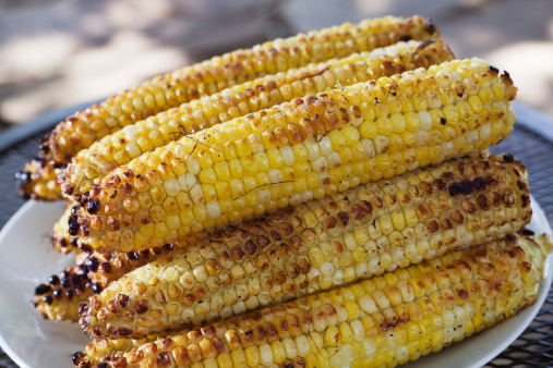 Subject: Grilled corn on the cob in the summer.