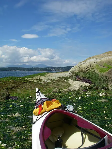 A beached kayak awaits the sea. 