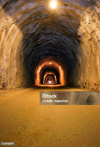 Long Dusty Tunnel Lit With Overhead Bulbs Stock Photo - Download Image Now - Mining - Natural Resources, Underground, Mine