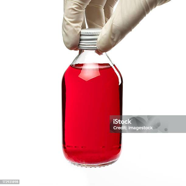 Holding A Bottle Of Cough Syrup Stock Photo - Download Image Now - Beauty, Bottle, Clothing