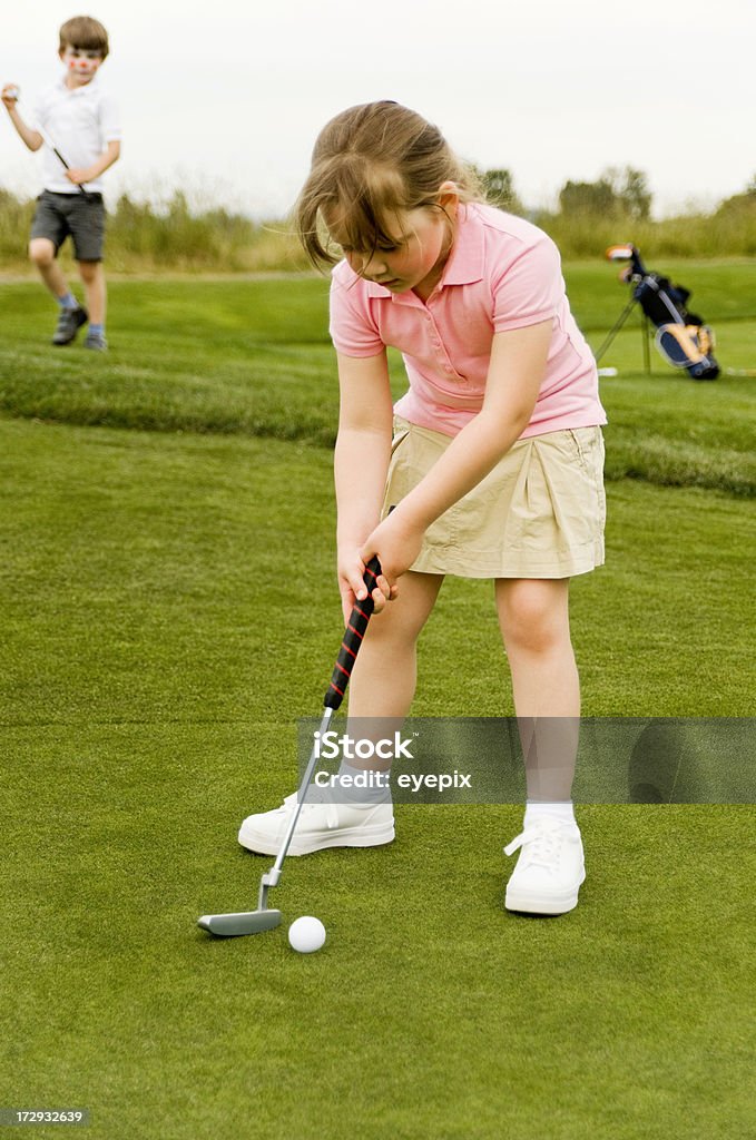 Bambina mettere - Foto stock royalty-free di Golf